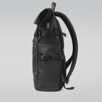 Side pocket of the 20L roll-top backpack holding a water bottle