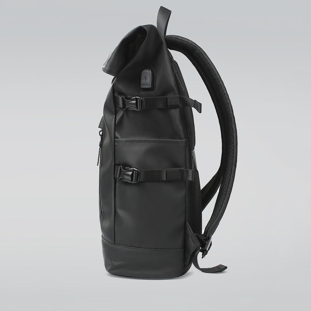 Side pocket of the 20L roll-top backpack holding a water bottle