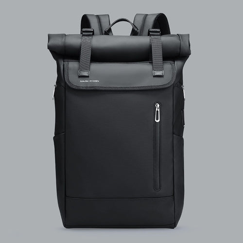 Matte black 20L roll-top commuter backpack with dual magnetic buckles and vertical zippered pocket on a gray background.