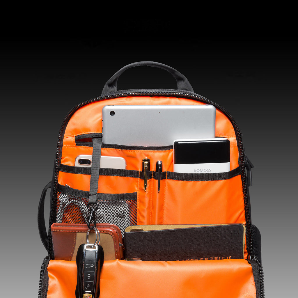 Men's waterproof laptop travel backpack with a dedicated compartment for office supplies.