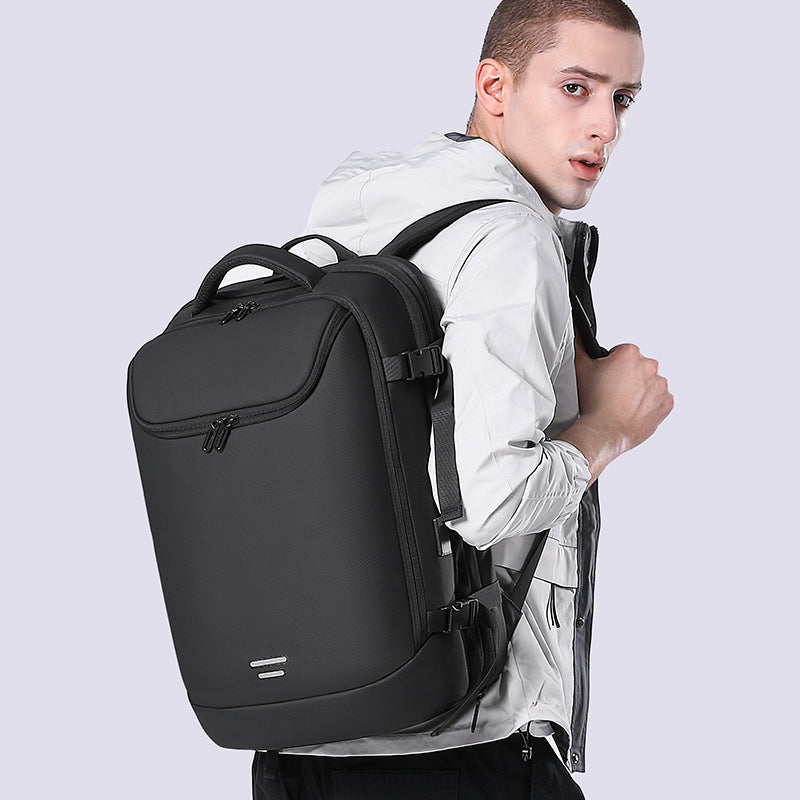 Display of the 50L expandable airline carry-on backpack being worn by a model.