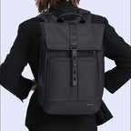 Model showcase of a 20–30L roll-top everyday backpack.
