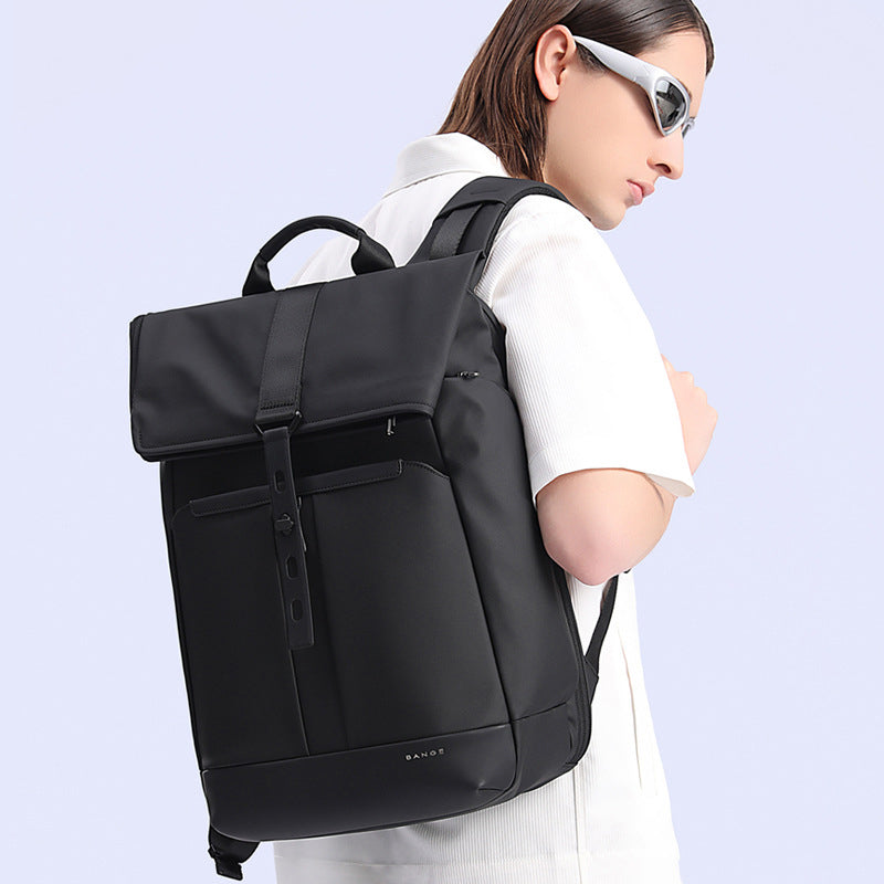 Display of a 20–30L roll-top everyday backpack being worn by a model.
