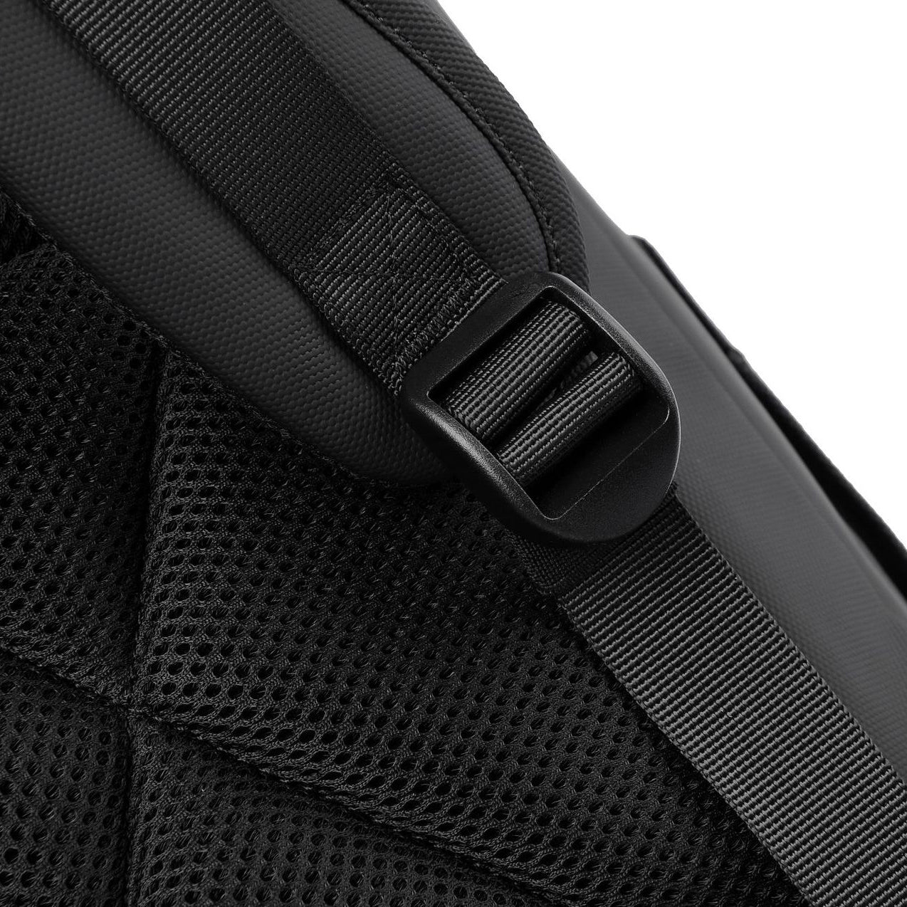 A close-up of the shoulder strap adjustment strap on a waterproof travel backpack.