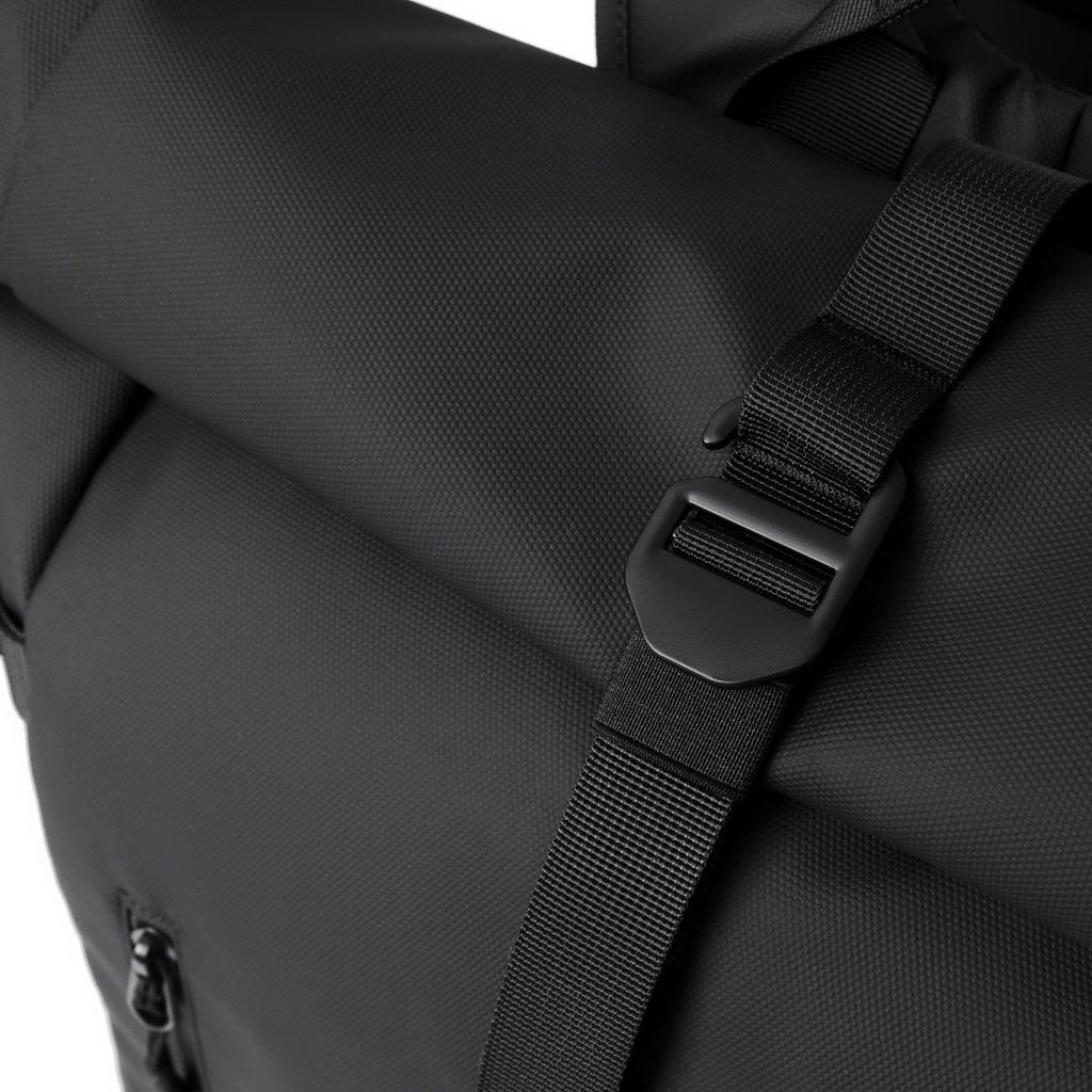 How the buckle mechanism works on the roll-top of an expandable backpack.