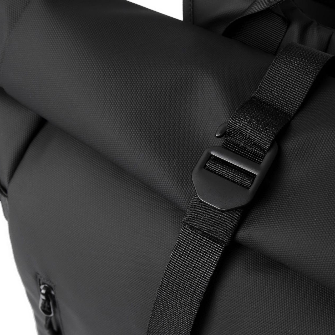 How the buckle mechanism works on the roll-top of an expandable backpack.