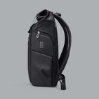 Side view of the water-resistant commuter daypack showing the side-access pocket.
